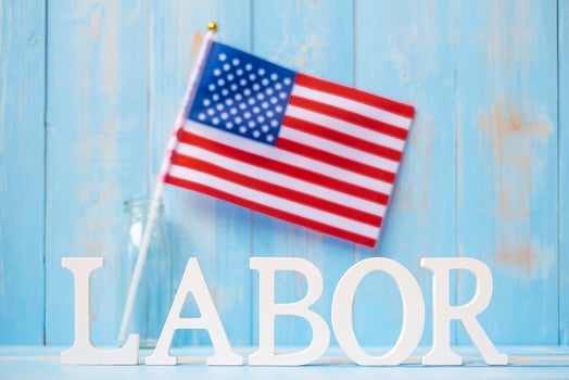 LABOR text and United States of America flag on wooden table background. happy Labor day and holiday celebration concepts photo