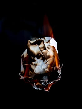 burning paper dark background photo