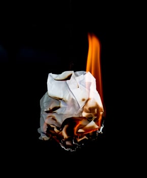 burning paper dark background photo