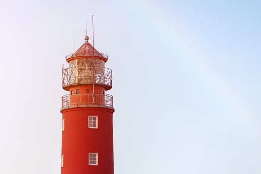 Lighthouse in seaport. Beautiful russian Baltiysk beacon. Scenery blue sky, copy space. photo