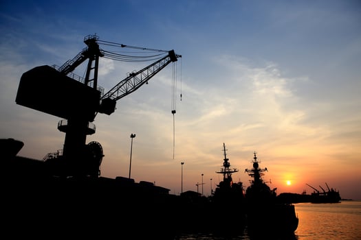 Cranes in dockside at sunset photo