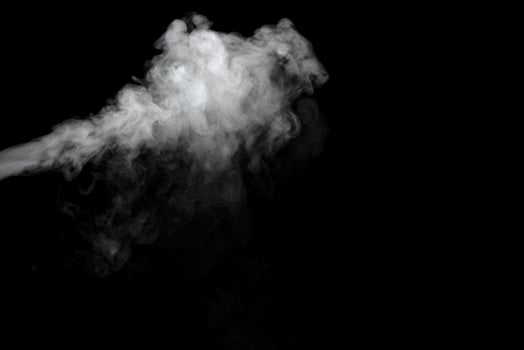 Abstract powder or smoke effect isolated on black background photo