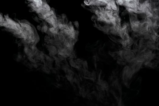 Abstract powder or smoke effect isolated on black background photo