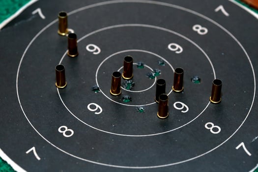 Bull eye target with bullet hole photo