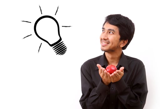 Happy young man coming up with an idea photo