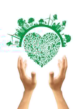 Green concept. Tree on the earth in hand photo