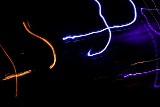 Lights in dark. Movement of glowing lines. Details of light music. photo