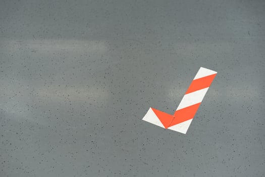 Red white marking tape to correct shape and sign for the area can stand here on the train. photo