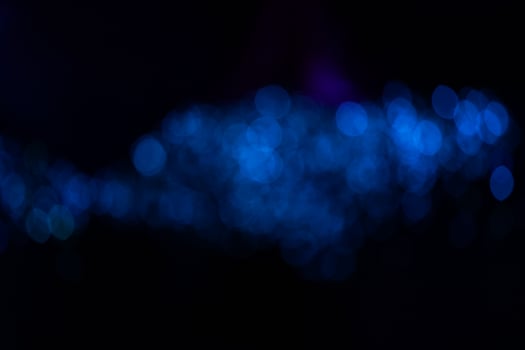 Fantastic blurry and bokeh dark blue theme background in the mystry cave. photo
