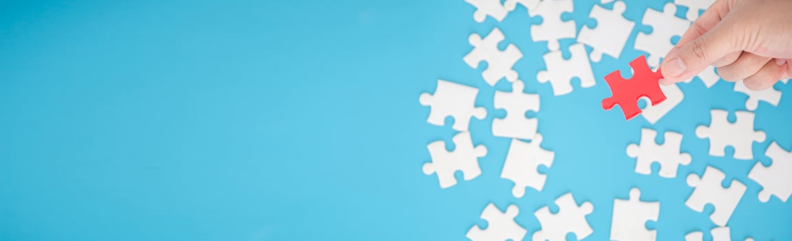 Top view of jigsaw puzzle on blue background photo