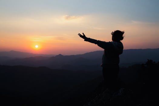 woman worship on sunset photo