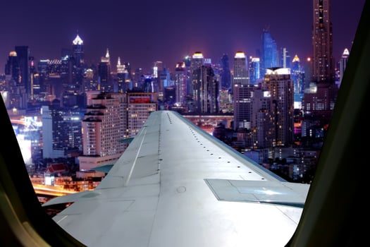 Evening flight on twilight sky, amazing view from the window plane. Window seat on airplane overlooking  city at night view . photo
