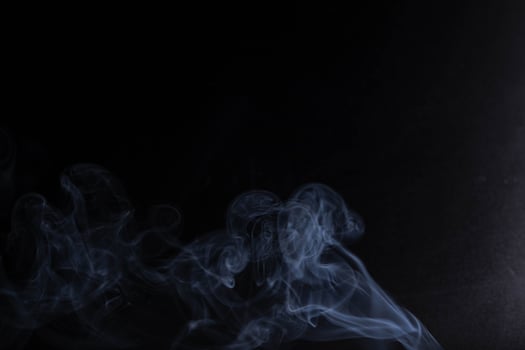 white smoke on a black background photo