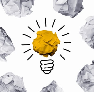 Good idea sign concept with paper light bulb isolated in white background. Crumpled paper ball with hand drawin photo