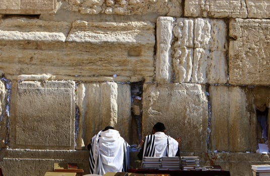 Notes in the Wailing Wall in Jerusalem with their requests and desires addressed to God. photo