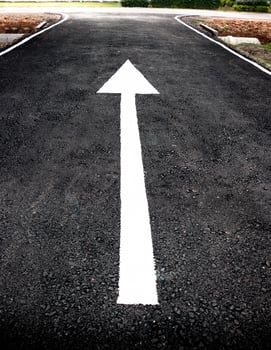 white arrow on black road photo