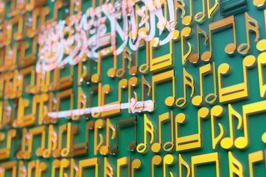 Musical notes lined up in even rows against the backdrop of the National Flag of  Saudi  Arabia . The concept of the national anthem, music. 3D illustration photo