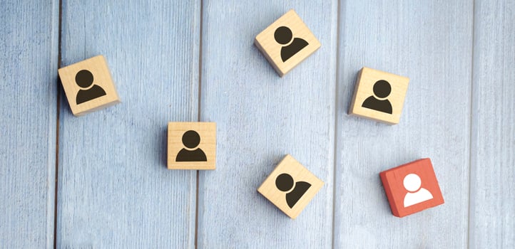 Building a strong team, Wooden blocks with people icon on blue background, photo