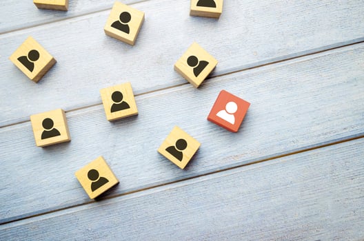 Head hunting and leadership concept. Wooden cube block with human icon symbol. photo