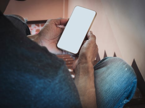 Mockup white screen cell phone. hand people man holding using mobile phone with blank screen mock up background for advertise marketing business. Concept marketing on smartphone. photo