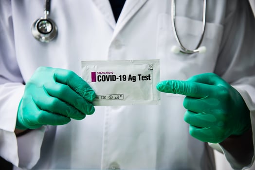 Doctor show rapid antigen test Covid -19 self repid test set photo