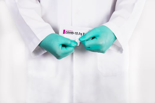 Doctor show rapid antigen test Covid -19 self repid test set photo