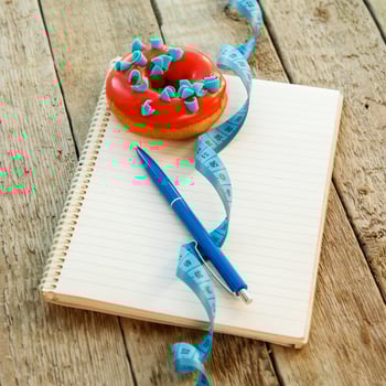 Colorful donuts and notepad photo
