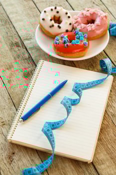 Colorful donuts and notepad photo
