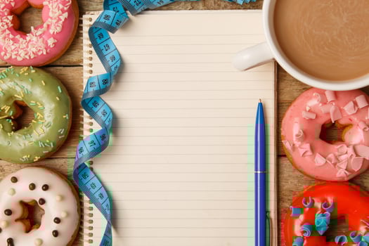 Colorful donuts and notepad photo