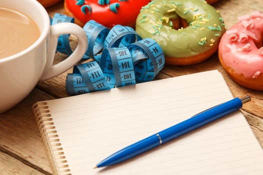 Colorful donuts and notepad photo