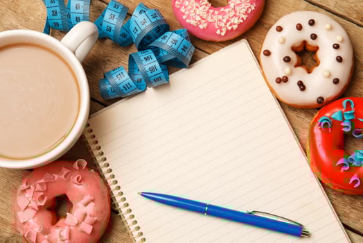 Colorful donuts and notepad photo