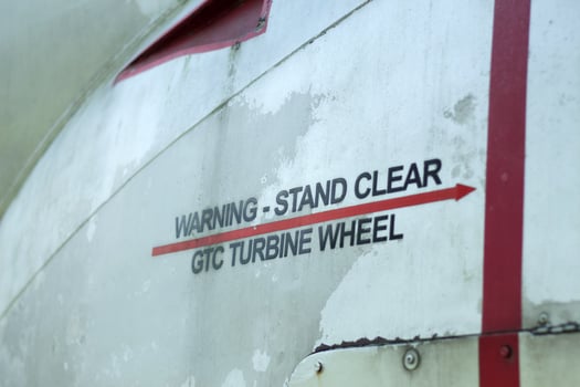 Warning stand clear turbine wheel decal on an old aircraft. photo
