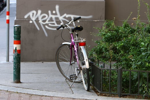 Bicycle stands on the street in a big city photo
