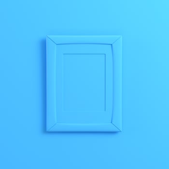 Blank frrame on bright blue background photo