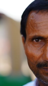 half face of indian man selective face photo
