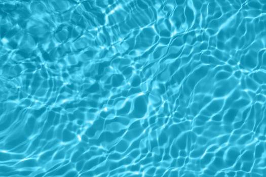 Defocus blurred blue watercolor in swimming pool rippled water detail background. Water splash, water spray background. photo