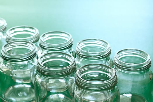 group of clear bottle with green background. photo