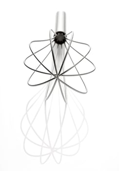 Stainless steel egg beater or egg whisk photo