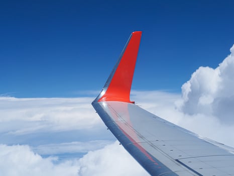 Aerial view of sky seen through airplane window photo