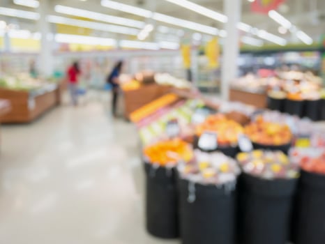 Grocery store blur background with customers photo