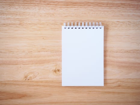 Notepad on the wooden desk table photo