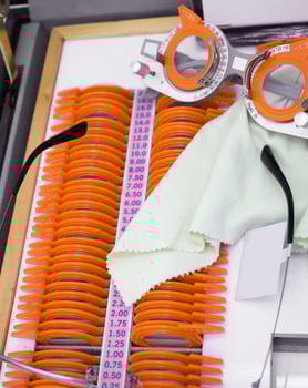 set of trial lenses for phoropter for eye examination photo