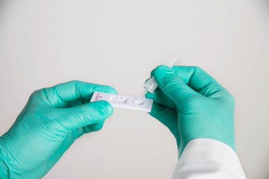 Doctor showing rapid antigen test Covid -19 self repid test set photo