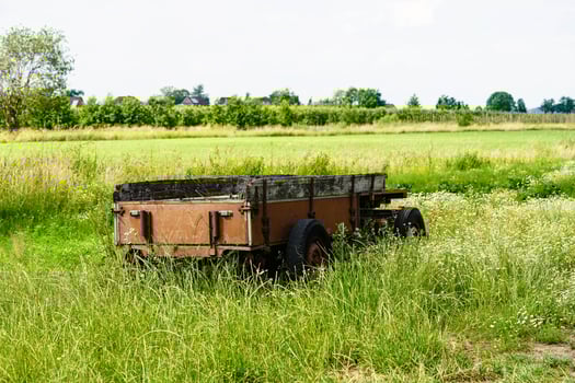 an abandoned and forgotten old agricultural utility vehicle in the old country of Hamburg photo