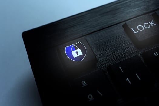 Keyboard with blue security shield concept. Cyber security data protection business technology. photo