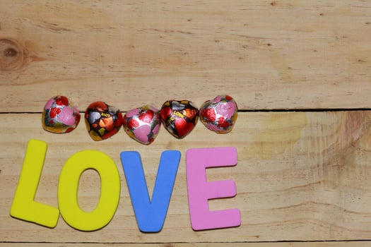 Love letters and Chocolate heart on the wooden floor. Background Valentine's Day with hearts. valentine concept. Space for text. photo