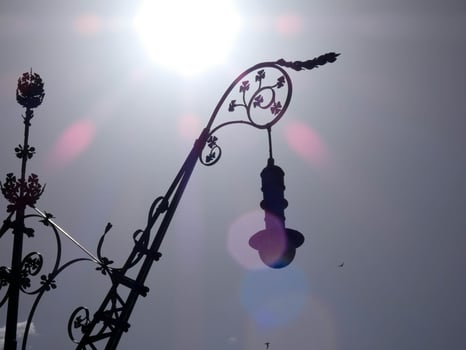 backlit details of a modernist chandelier in the city of Barcelona photo
