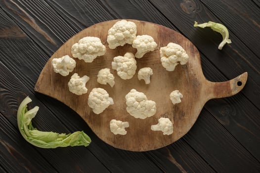 Raw, fresh organic cauliflower on a wooden background. Healthy eating, low carb diet concept photo