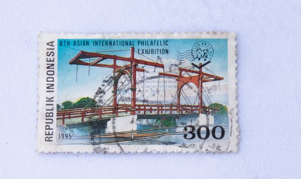 Sidoarjo, Jawa timur, Indonesia, 2022 - Close-up photo of old school stamps with pictures of red suspension bridges in Indonesia