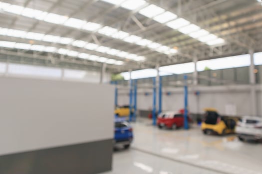 car service centre with auto at repair station bokeh light defocused blur background photo